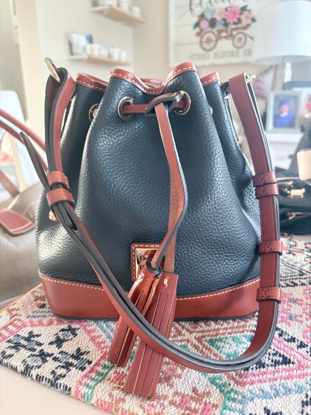 Dooney & Bourke Navy Pebbled Leather with Brown Trim Drawstring Crossbody